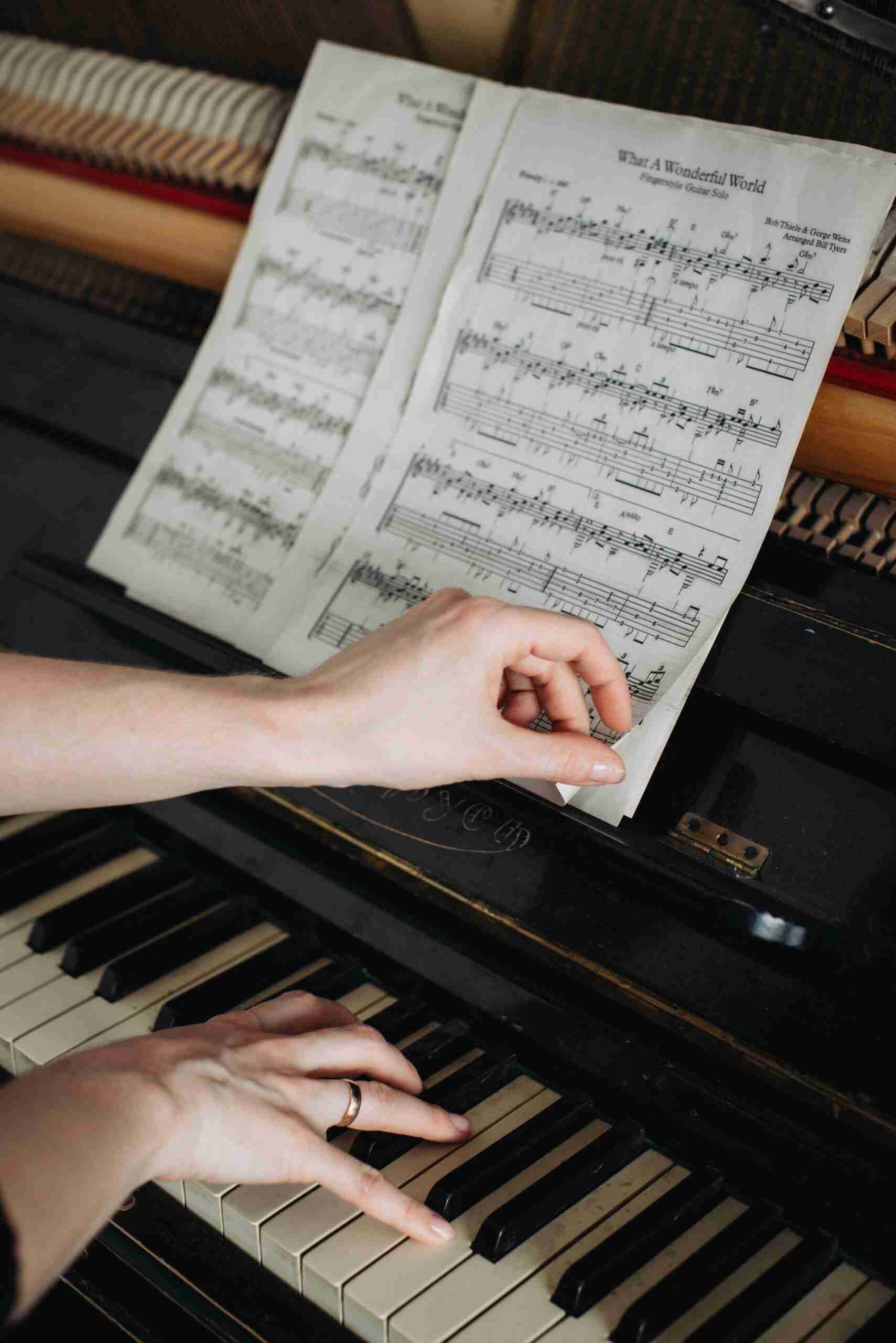a piano student learning piano turning pages during piano lessons