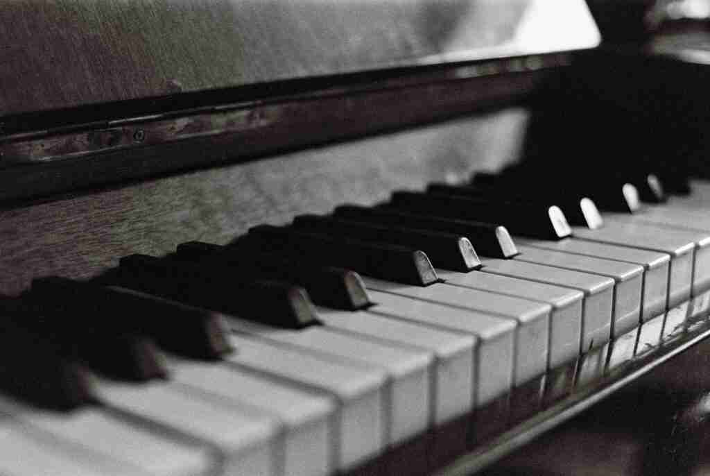 close up of piano keyboard in black and white